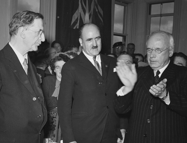  Eamon de Valera, Frank Aiken and Peter Fraser having a very animated discussion at a special reception in honour of the Irish leader at Parliament buildings Wellington, May 1948